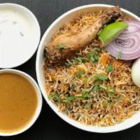 Chicken Dum Biryani · Chicken slow cooked in basmati rice with special herbs and spices; served with raita and sal...
