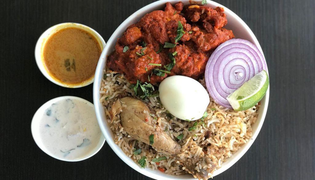 Mirchi Special Chicken Biryani · Chicken slow cooked in basmati rice with special herbs and spices topped with boneless pieces of chicken marianted in spicy sauce and served with raita and salan.