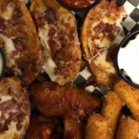 The Sampler · 4 Mozzarella Sticks, 4 Potato Skins and 4 Chicken Wings. Served with Ranch, Marinara and Sou...