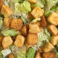 Classic Caesar Salad · Fresh, Crisp Romaine Lettuce, Parmesan Cheese and Seasoned Croutons. Served with Caesar Dres...