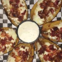 Potato Skins · 6 Potato Skins with Real Bacon and Cheese. Served with Sour Cream or Ranch Dipping Sauce.
