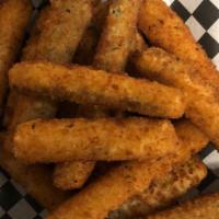 Fried Zucchini · Breaded zucchini deep fried to perfection. Served with Marinara Sauce or Ranch Dipping Sauce.