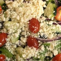 Greek Salad · Fresh, Crisp Romaine Lettuce, Sliced Onions, Black Olives, Cucumbers, Fresh Tomatoes and Fet...