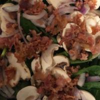 Spinach Salad · Baby Spinach, Fresh Sliced Mushrooms, Sliced Onions and Real Bacon. Served with Balsamic Vin...