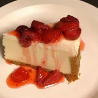 Cheesecake w/Strawberry Sauce · Rich and Creamy Cheesecake Served with Strawberry Sauce