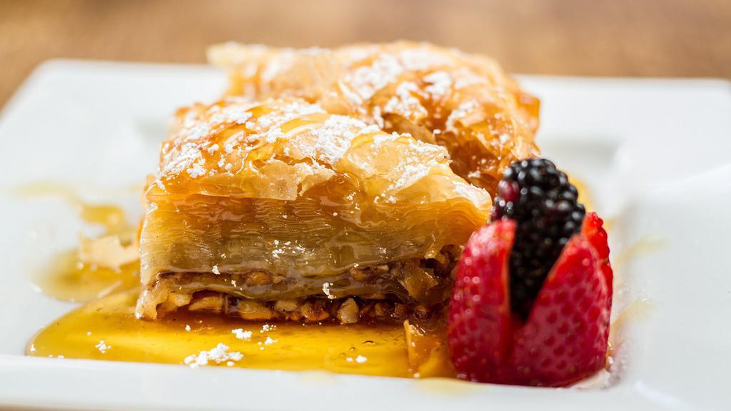 Baklava · The most famous Greek pastry! Layers of phyllo dough, walnuts, cinnamon, sugar and Greek honey.