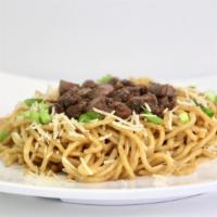 Beef Garlic Noodles · Egg noodles and beef tossed in our house-made signature garlic butter topped with green onio...