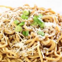 Plain Garlic Noodles · Egg noodles tossed in our house-made signature garlic butter and topped with green onions an...