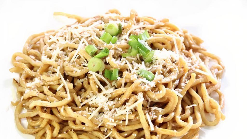 Plain Garlic Noodles · Egg noodles tossed in our house-made signature garlic butter and topped with green onions and parmesan cheese.