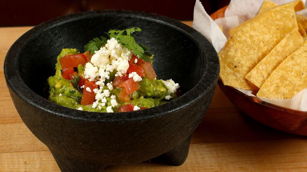 Home-Made Guacamole · Served with homemade chips: Vegetarian, gluten-free. With cilantro, lime juice, pico de gallo and home-made queso fresco.