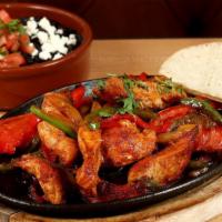Fajitas · Gluten-free. With tomatoes, onions, and bell peppers, served with tortillas, rice and beans.