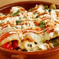 El Vegetariano Enchiladas · Gluten-free. Roasted corn, cauliflower, pasilla peppers, mushrooms, orange oaxaca sauce and ...
