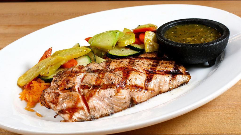 Grilled Salmon Plate · With Spanish rice, sautéed veggies and a poblano pepper garlic sauce.