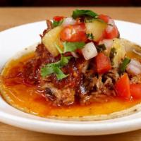 Carnitas · Slow cooked berkshire pork, salsa roja and pineapple pico de gallo. With la palma organic co...