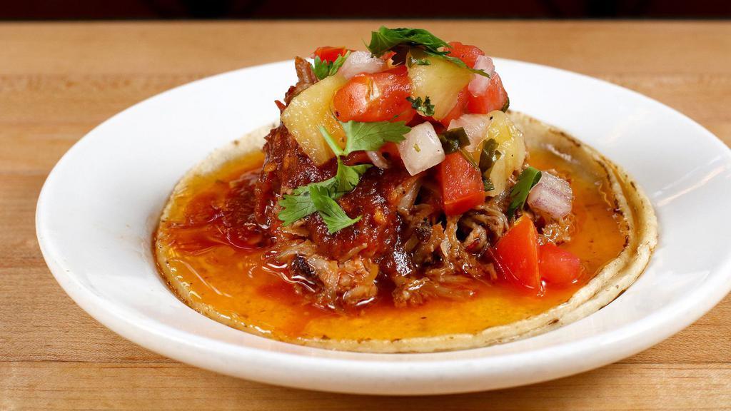 Carnitas · Slow cooked berkshire pork, salsa roja and pineapple pico de gallo. With la palma organic corn tortillas.