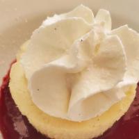 Cheesecake · Vanilla cheesecake with blackberry sauce.