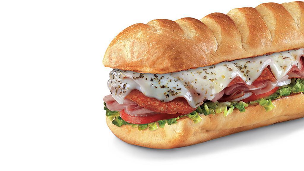 Italian™ , Large (11-12 Inch) · Genoa salami, pepperoni, Virginia Honey Ham, melted provolone, Italian dressing, and seasonings, served Fully Involved® (mayo, lettuce, tomato, onion, deli mustard, and a pickle spear on the side).