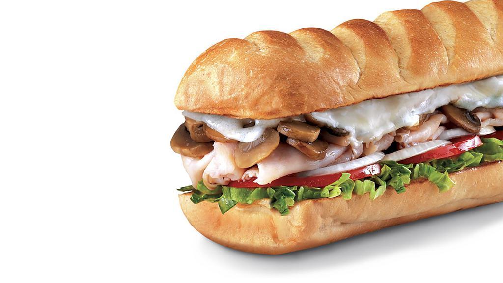 Engineer® , Large (11-12 Inch) · Smoked Turkey Breast with sauteed Mushrooms and melted Open-Eyed Swiss, served Fully Involved® (mayo, lettuce, tomato, onion, deli mustard, and a pickle spear on the side).