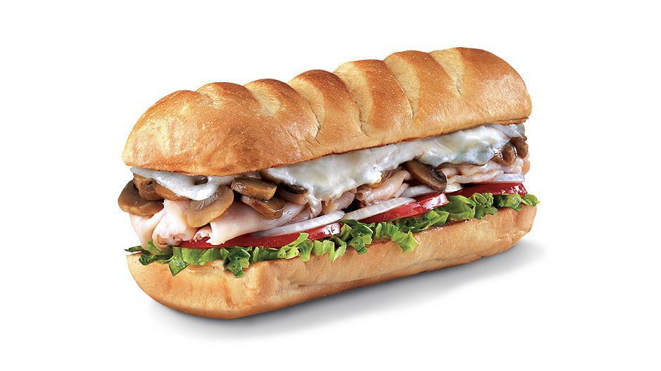 Engineer® , Small (3-4 Inch) · Smoked Turkey Breast with sauteed Mushrooms and melted Open-Eyed Swiss, served Fully Involved® (mayo, lettuce, tomato, onion, deli mustard, and a pickle spear on the side).