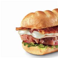 Club On A Sub™, Large (11-12 Inch) · Smoked turkey breast, Virginia honey ham, crispy pepper bacon, and melted Monterey Jack, ser...
