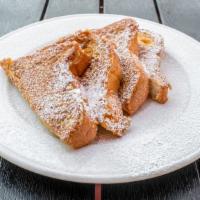 French Toast · Texas toast dipped in special egg batter,  powdered sugar.