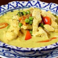 Green Chicken Curry · Spicy. Spicy green chicken curry with peas, sweet basil, coconut milk.