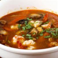 Tom Yum Soup · Vegetarian. Spicy. Spicy and sour lemongrass soup with mushrooms, tomatoes, cilantro and cho...