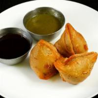 Samosa · Fine filo pastry, pea, and potato filling warmly spiced with fresh herbs.