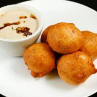 Mysore Bonda- Medium Spicy · A mix rice flour, suji, yogurt, cooked with Andhra style, served chutney’s.