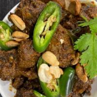 Rayalaseema Goat Vepudu- Extra Spicy · Marinated bone in goat pieces cooked in slow flame with rich Indian herbs and pan fried with...