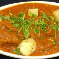 Goat Vindaloo · A Goan style lamb curry in vinegar infused red chilli paste.