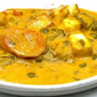 Navratan Korma- Mild Spicy · Mixed vegetables simmered in creamy tomato sauce, paneer cheese, cashew nuts, and spices.