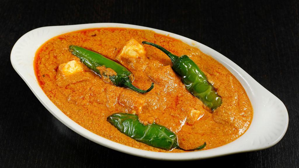 Paneer Aur Mirchi Ka Salan- Medium Spicy · Homemade, spiced paneer with green long horn pepper in roasted peanut and tamarind gravy.