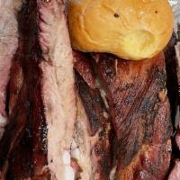 Emil's BBQ Platter · Sliced beef, pork loin and two styles of pork ribs.
