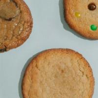 A Dozen Cookies + 1 · We will send you 4 Chocolate Chip, 3 Snickerdoodle, 3 M+M's, 3 Vegan Double Chocolate