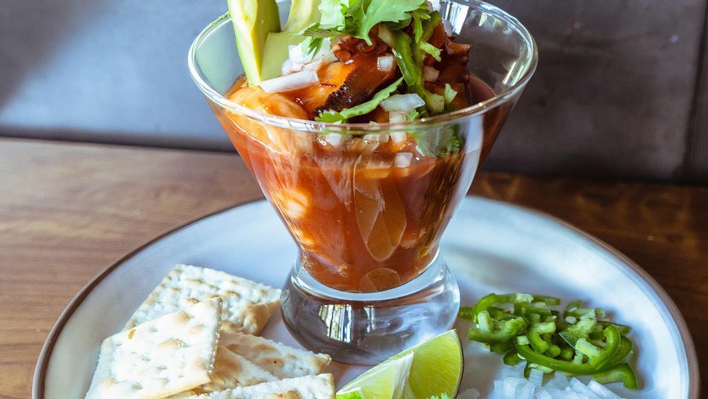 Cóctel de Mariscos · Choice of shrimp, octopus, or mixto served with cocktail sauce, onion, cilantro, serrano pepper.