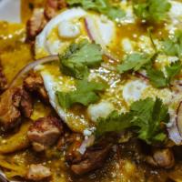 Chilaquiles Verdes · Traditional Mexican breakfast made with tortilla chips simmered in green sauce and topped wi...