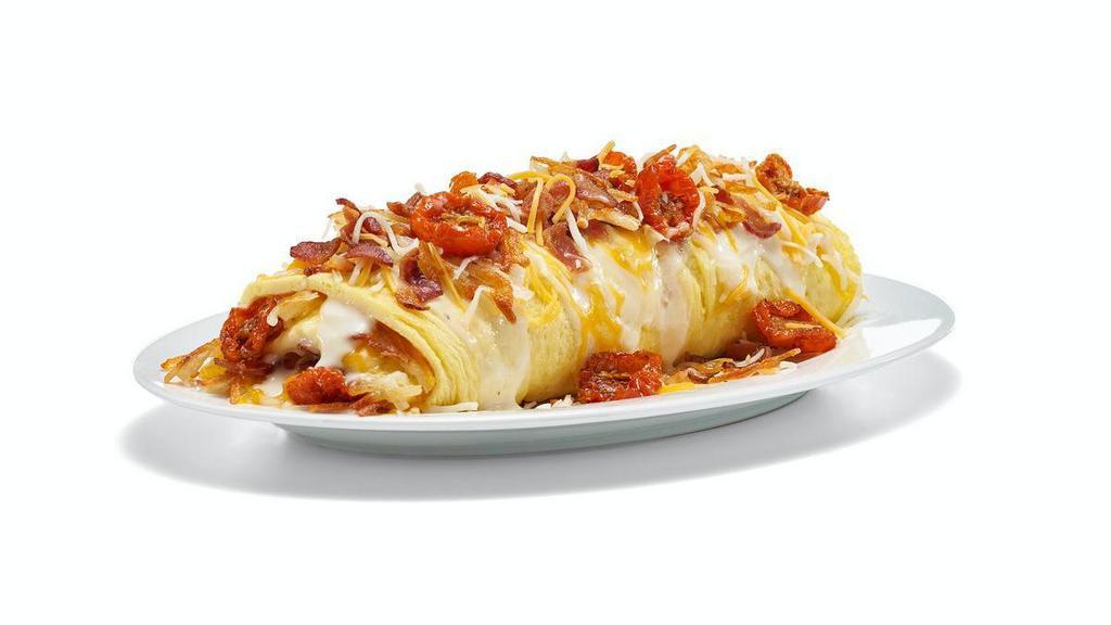 New! Deluxe Three Cheese & Bacon Omelette · Stuffed and topped with Jack & Cheddar cheeses, white cheese sauce, hickory-smoked bacon, crispy hash browns, and roasted cherry tomatoes.