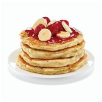 Strawberry Banana Protein Pancakes - (Full Stack) · A fresh-flipped power stack. Four protein pancakes filled with fresh banana slices. Topped w...