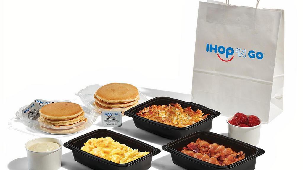 Pancake Creations Family Feast With Bacon · 8 of our world famous buttermilk pancakes, 4 servings each of scrambled eggs and golden hash browns, 8 hickory-smoked bacon strips, and choice of 2 pancake toppings. Serves 4. .  Available for IHOP ‘N GO only.  Not available for dine-in.