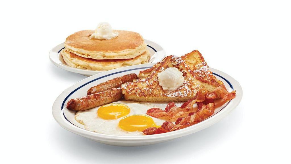 Split Decision Breakfast · Two eggs* your way, 2 custom cured hickory-smoked bacon strips, 2 pork sausage links, 2 triangles of thick-cut French toast & 2 fluffy buttermilk pancakes. .