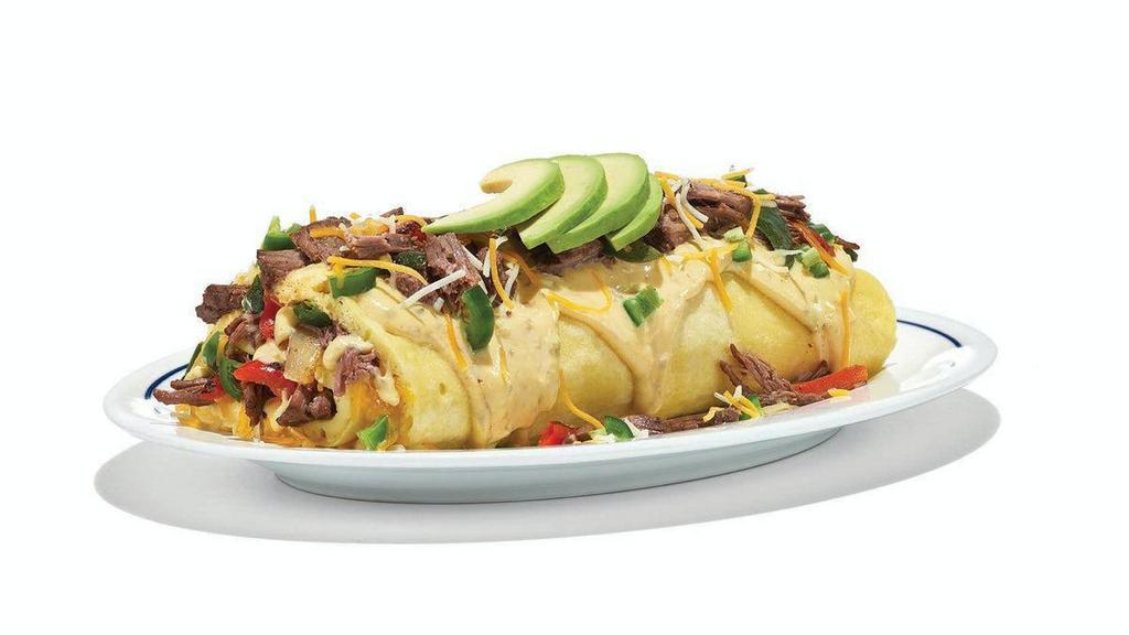 Spicy Poblano Omelette · We've put the eat in heat. Our omelette+ stuffed with fire roasted Poblano peppers, red bell peppers & onions, shredded beef, Jack & Cheddar cheese blend, fresh avocado, Poblano cream & chopped Serrano peppers.