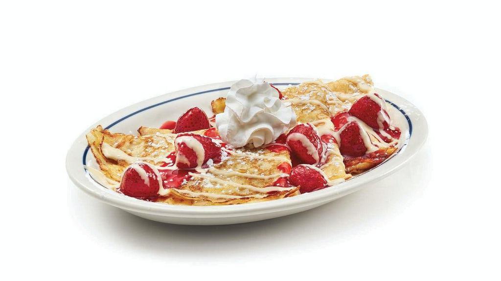 Strawberries & Cream Crepes · Four delicate crepes topped with glazed strawberries & vanilla cream drizzle.
