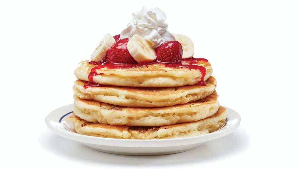 Strawberry Banana Pancakes · Little known fact: Strawberries and Bananas are best friends. Four fluffy buttermilk pancakes filled with fresh banana slices. Topped with glazed strawberries & more banana slices.