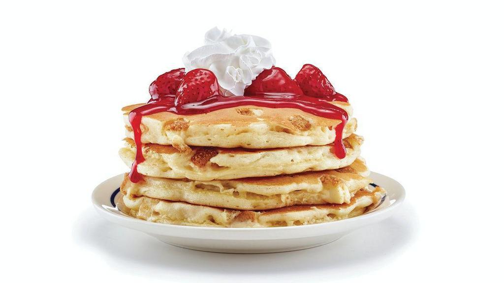 New York Cheesecake Pancakes · We’ve combined a New York classic with our classic pancakes. Four fluffy buttermilk pancakes filled with cheesecake bites & topped with glazed strawberries.