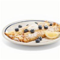 New! Lemon Ricotta Blueberry Crepes · Two delicate crepes filled with creamy lemon ricotta, topped with lemon ricotta, fresh blueb...