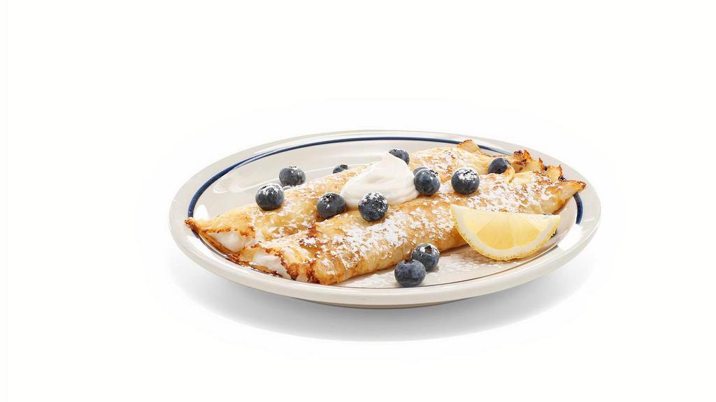 New! Lemon Ricotta Blueberry Crepes · Two delicate crepes filled with creamy lemon ricotta, topped with lemon ricotta, fresh blueberries, powered sugar & a lemon wedge.