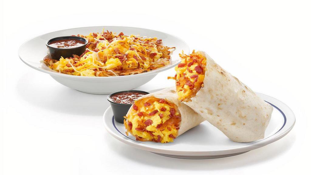 The Classic Burrito & Bowl  · A true breakfast classic with scrambled eggs+, choice of hickory-smoked bacon pieces or diced sausage, shredded Jack & Cheddar cheese and hash browns all wrapped up in a warm flour tortilla or scrambled in a bowl. Served with our salsa and choice of side.