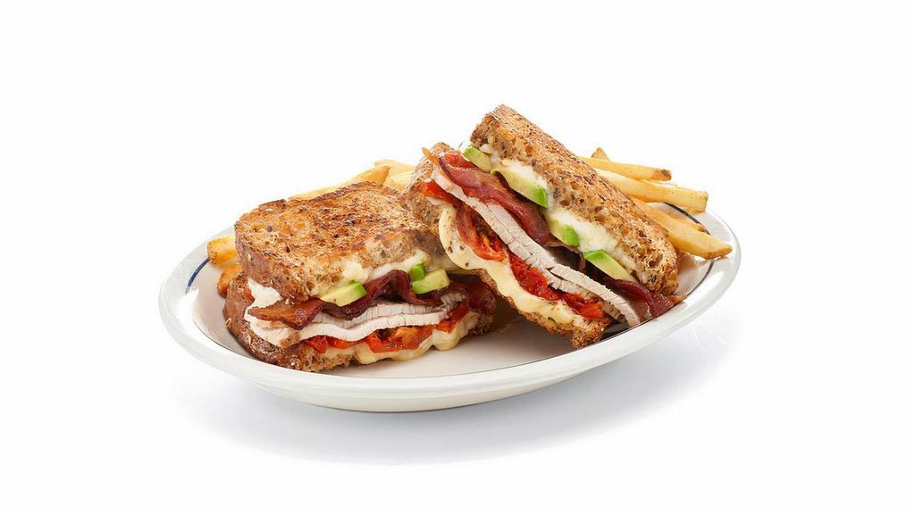 Cali Roasted Turkey Melt · Like sunshine in a sandwich. All-natural roasted turkey breast, hickory-smoked bacon, Whole Milk cheese, roasted cherry tomatoes, fresh avocado & mayo on grilled multigrain bread.