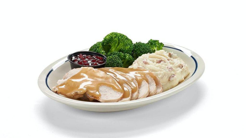All-Natural Roasted Turkey · Carved all-natural roasted turkey breast topped with turkey gravy.